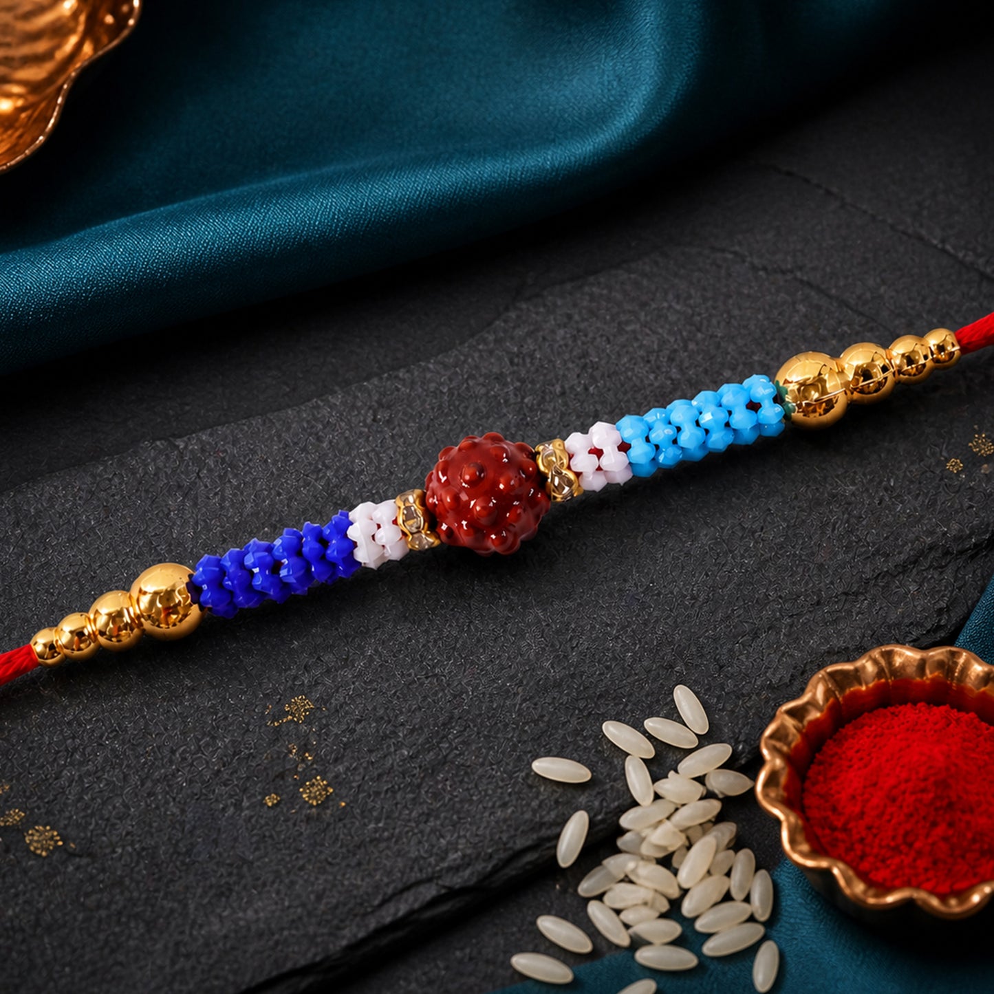 Blue Red Beaded Rakhi with Gold Accents and Classic Festive Brother Gift Appeal Ideas