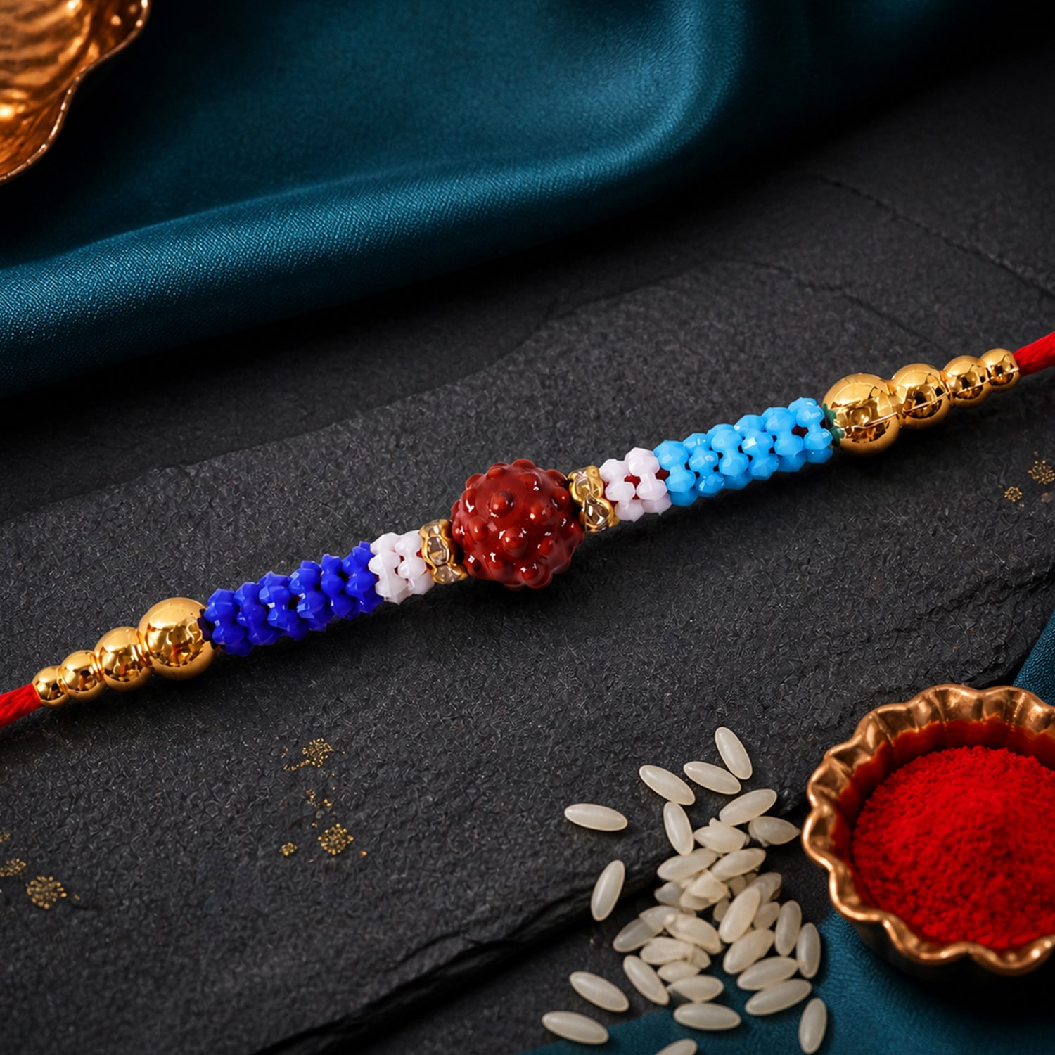 Blue Red Beaded Rakhi with Gold Accents and Classic Festive Brother Gift Appeal Ideas