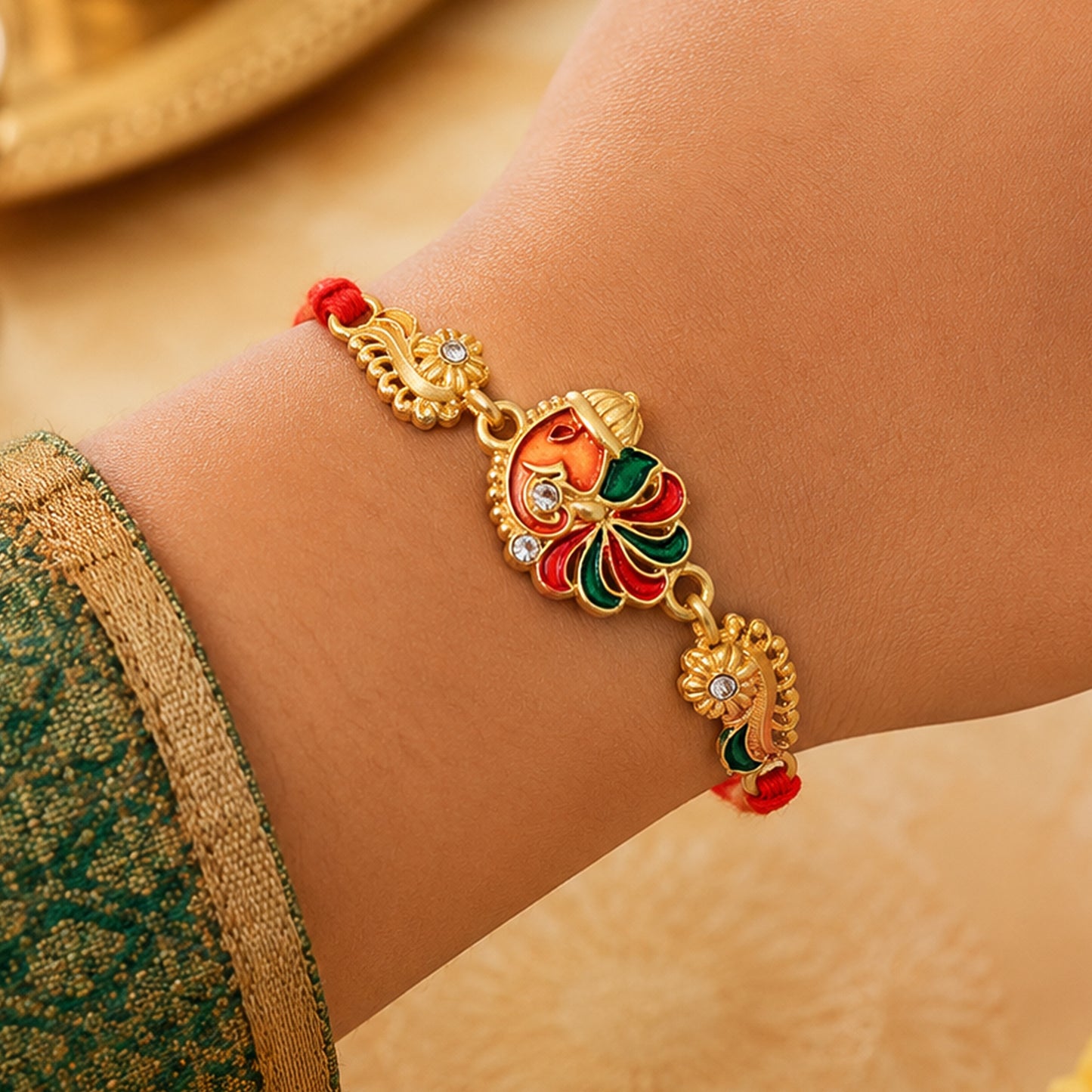 Gold-Toned Lord Ganesha Rakhi with Multicolor Enamel, Crystal Accents & Designer Red Thread