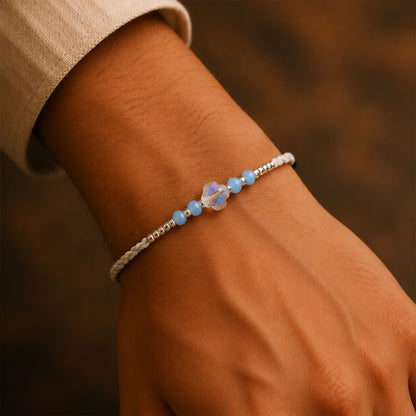 Blue Crystal Bead Rakhi with Round Stone Centre, Silver Highlights and Red Thread