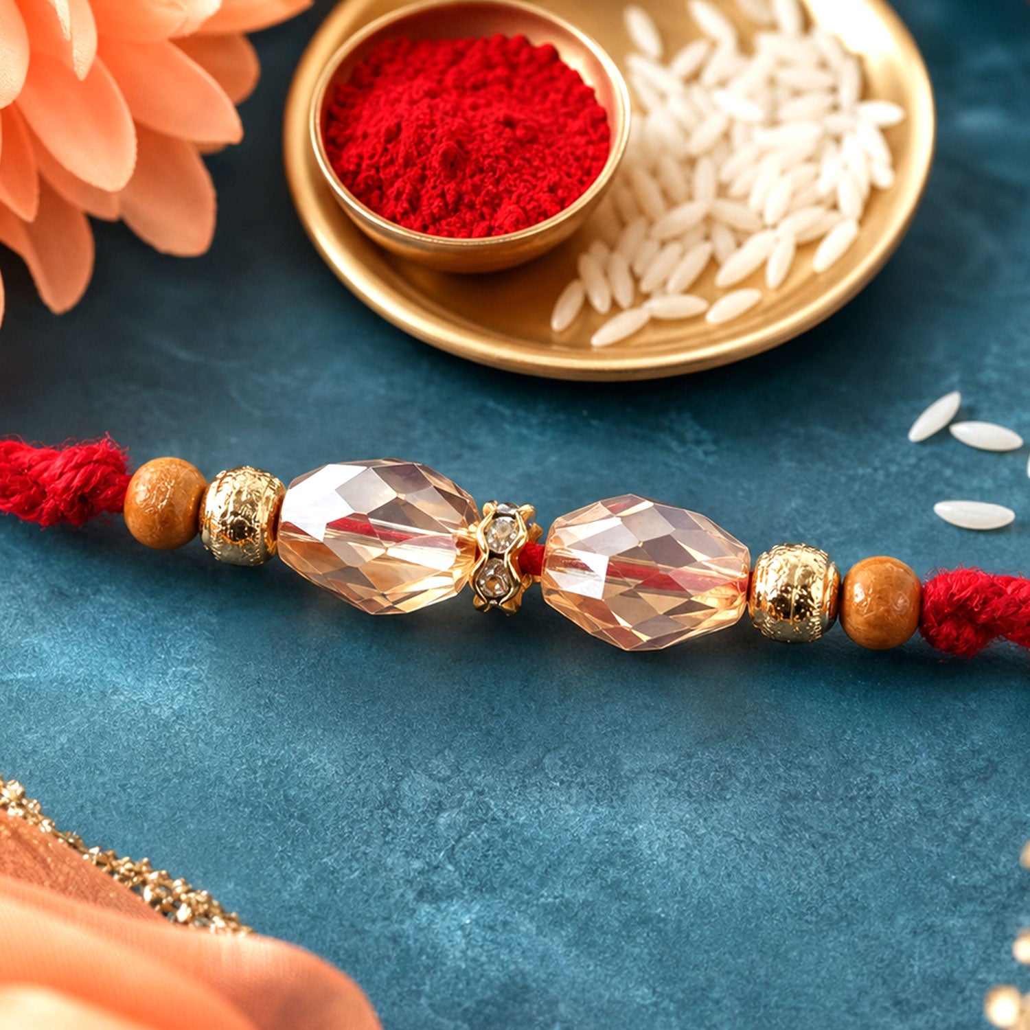 Red Thread Rakhi with Champagne Crystal Bead Pendant Accents