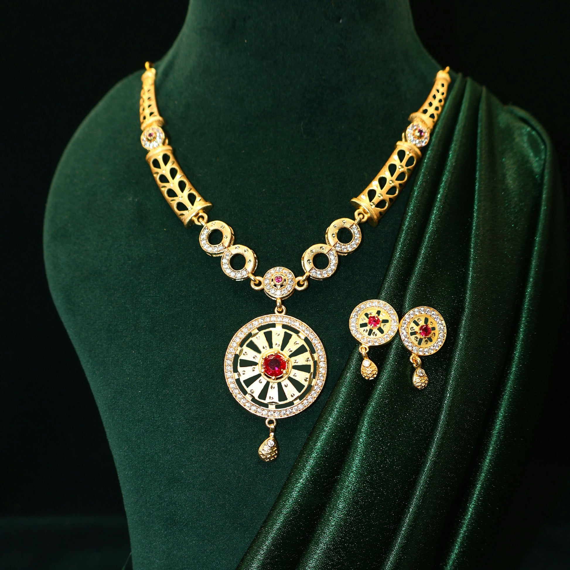 Gold Plated Round Pendant Forming Necklace Set with Ruby Stone & AD Detailing