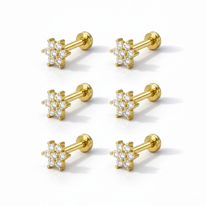 Close-up of gold plated crystal flower labret designed for comfortable nose and ear piercings