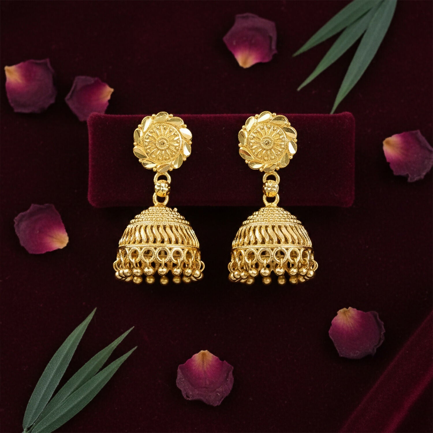 Gold plated traditional jhumka earrings with intricate detailing