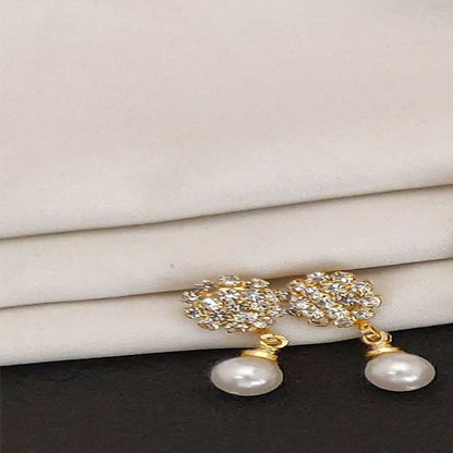 Close-up view of elegant traditional jhumka earrings in gold plating