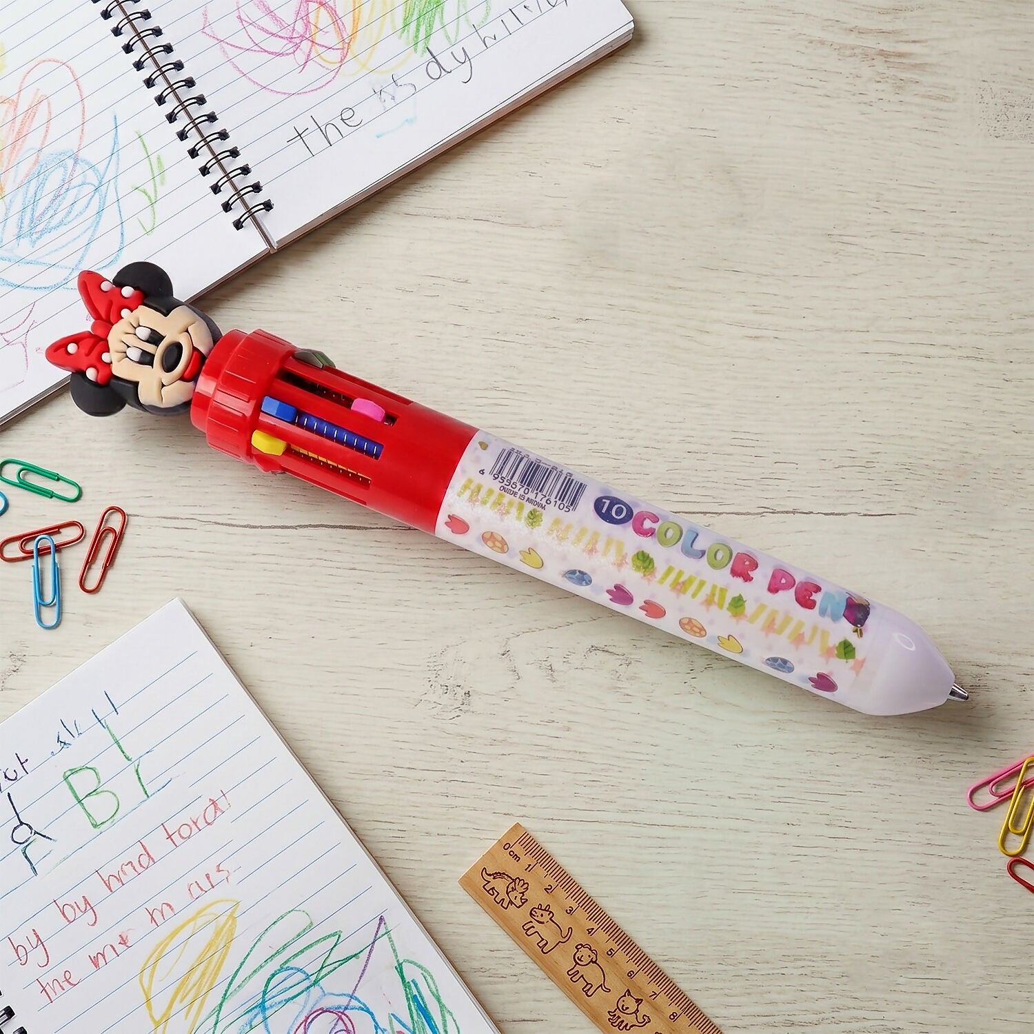 Close-up of cartoon character multi ink ball pen showing ink colors