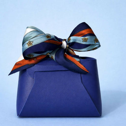 Blue handbag-style cosmetic organizer showing open compartments