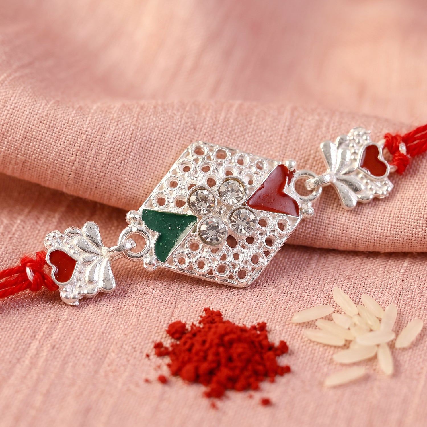 Silver Elephant Charm Rakhi with Red Green Stones and Crystals