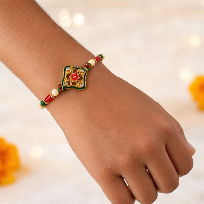 Green Enamel Kite Shaped Pendant Rakhi with Red Flower Center