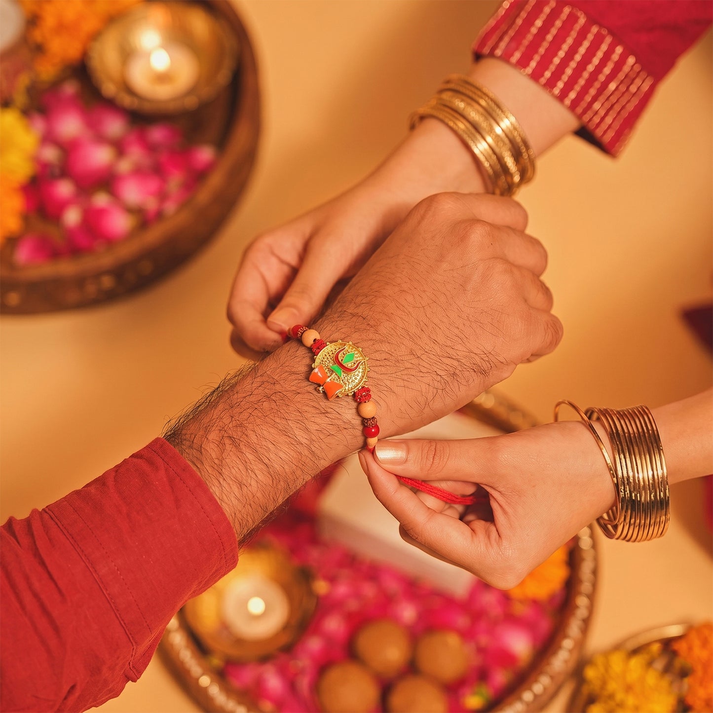 Trishul Damru Rakhi with Peach Beads and Red Thread