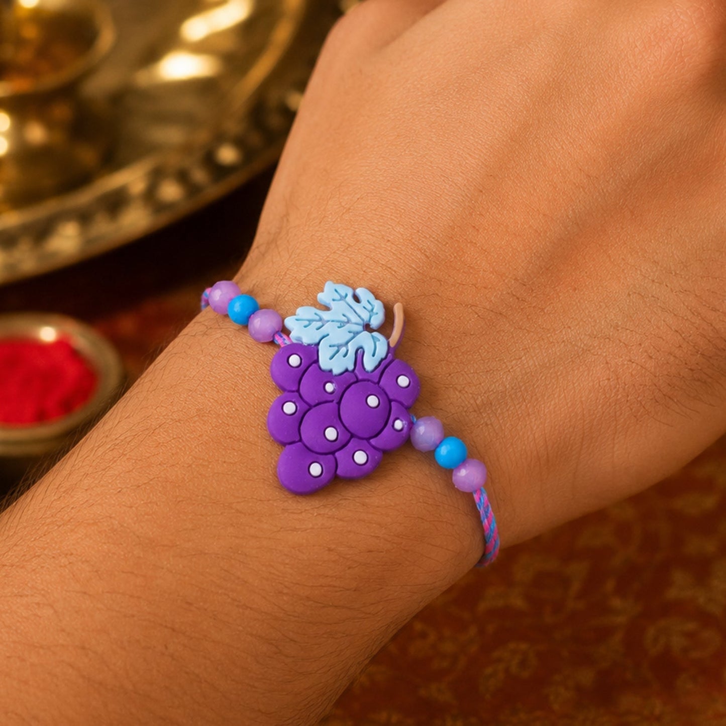 Shop Grape Bunch Charm Kids Beaded Designer Rakhi for Brother (10pcs)
