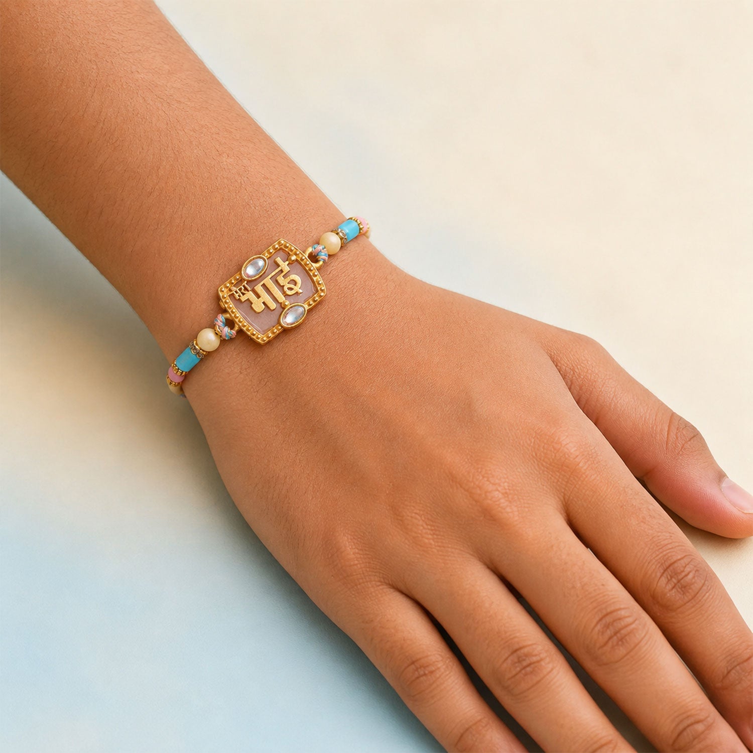 Bhai Script Pendant Rakhi with Lilac Stone and Kundan Accents
