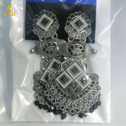 Oxidized silver chandbali earrings styled with ethnic attire
