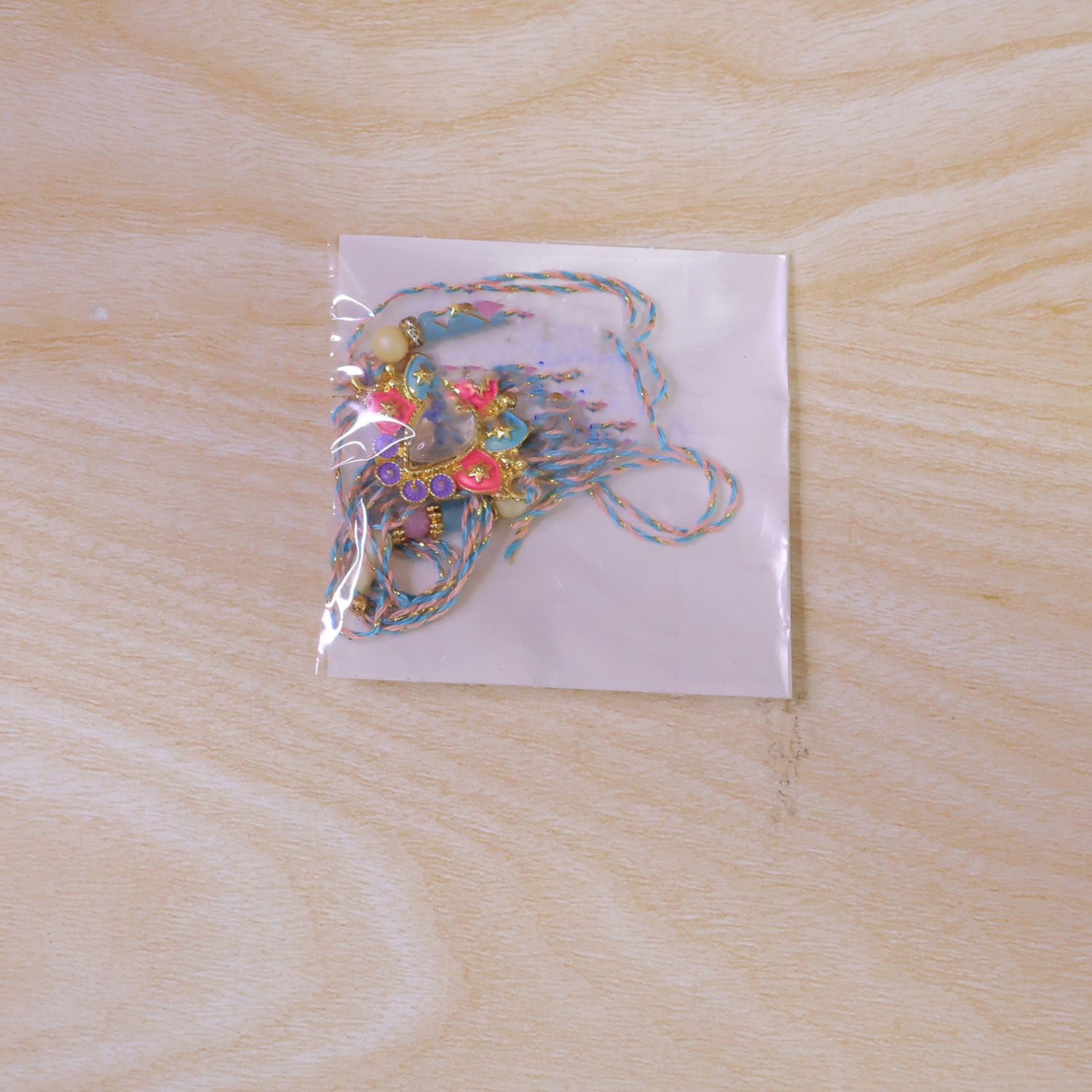 Multicolor Floral Kundan Pendant Rakhi with Pastel Beads