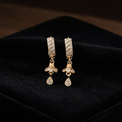 Pair of gold-tone crystal studded dangle earrings with teardrop stone detail