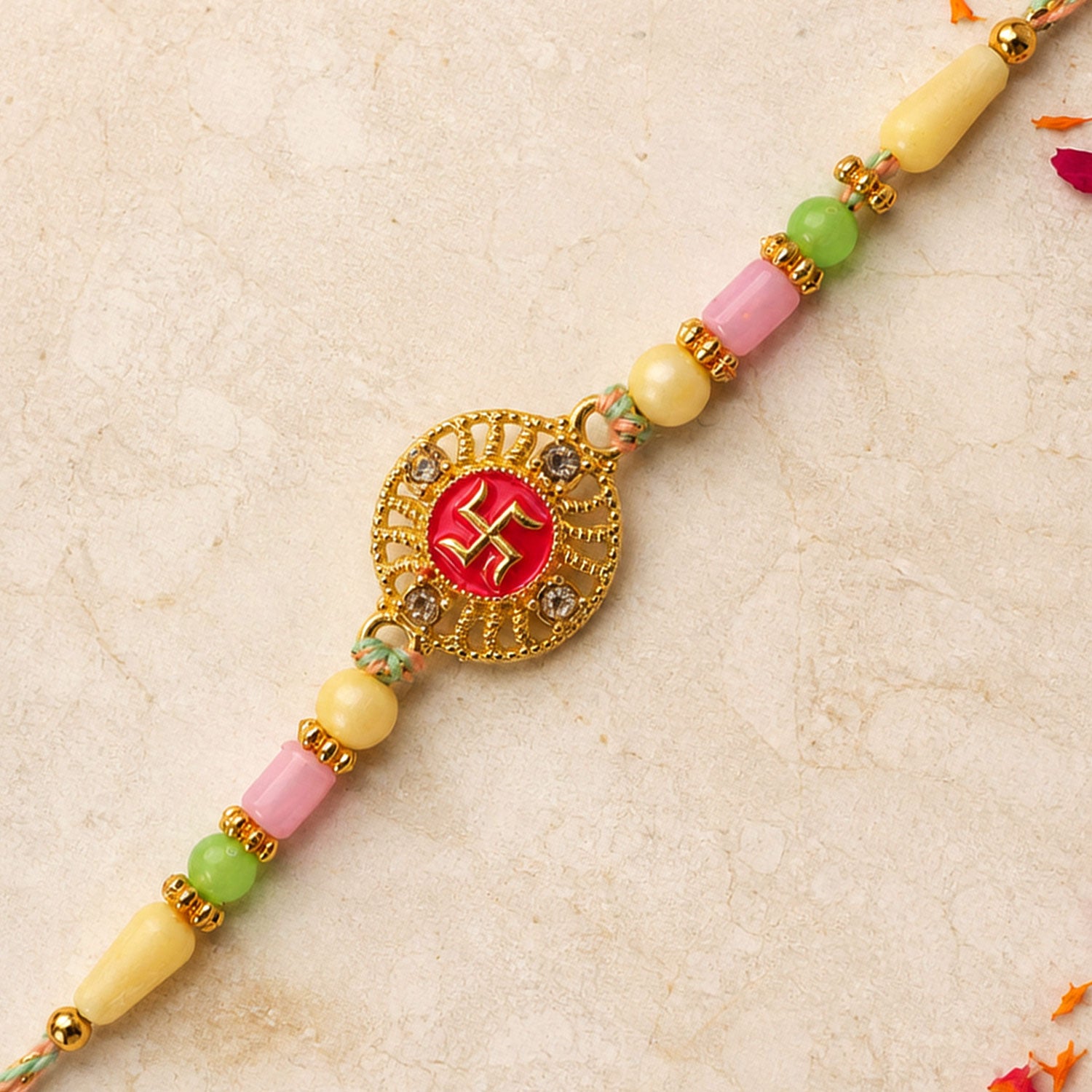 Swastik Pendant Rakhi with Kundan Stones and Pastel Beads