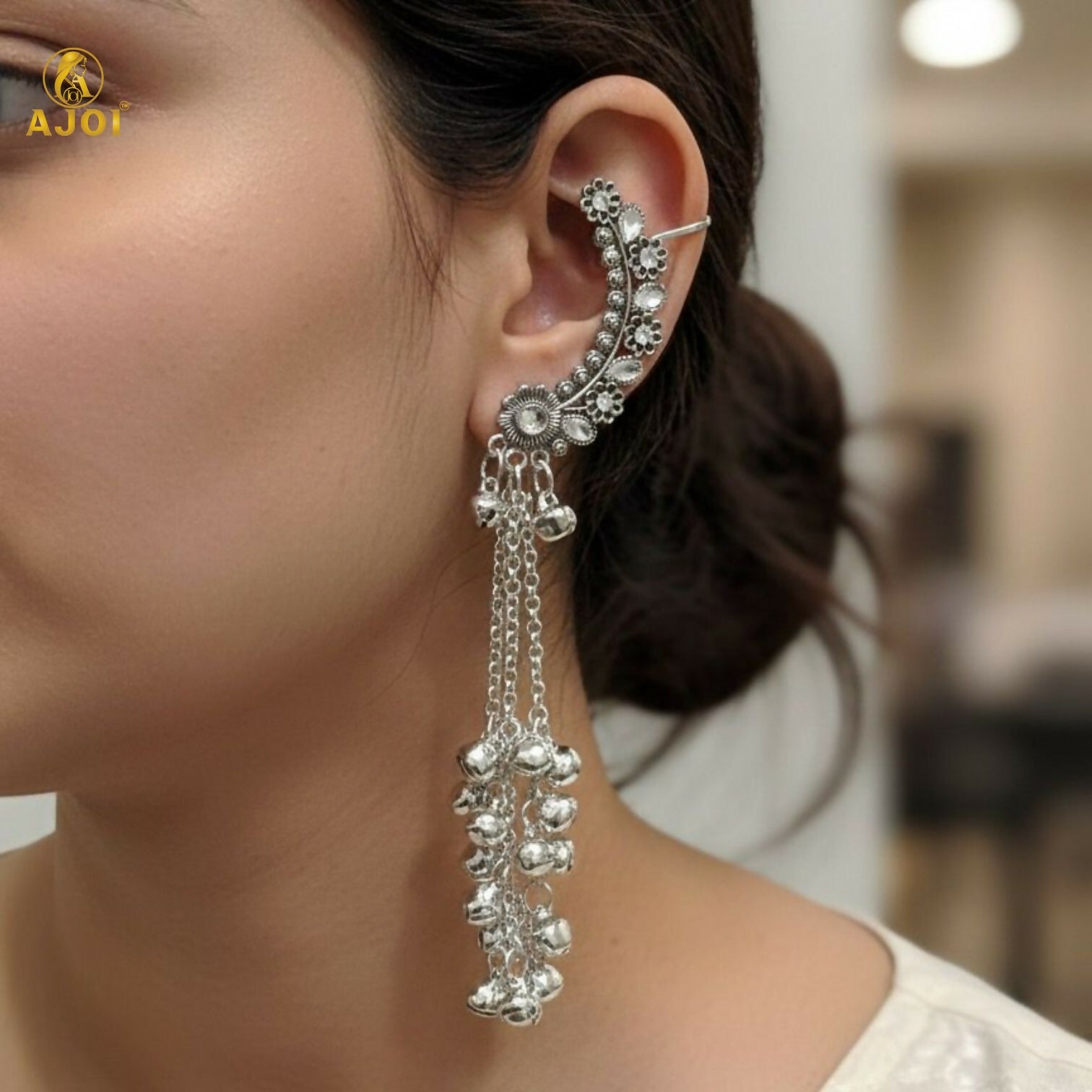 Side angle of silver oxidised Chandbali jhumka earrings showing dangling ghungroo beads