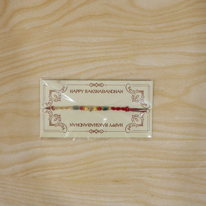 Beautiful Pearl Bead Rakhi with Soft Festive Shades and Elegant Designer Look