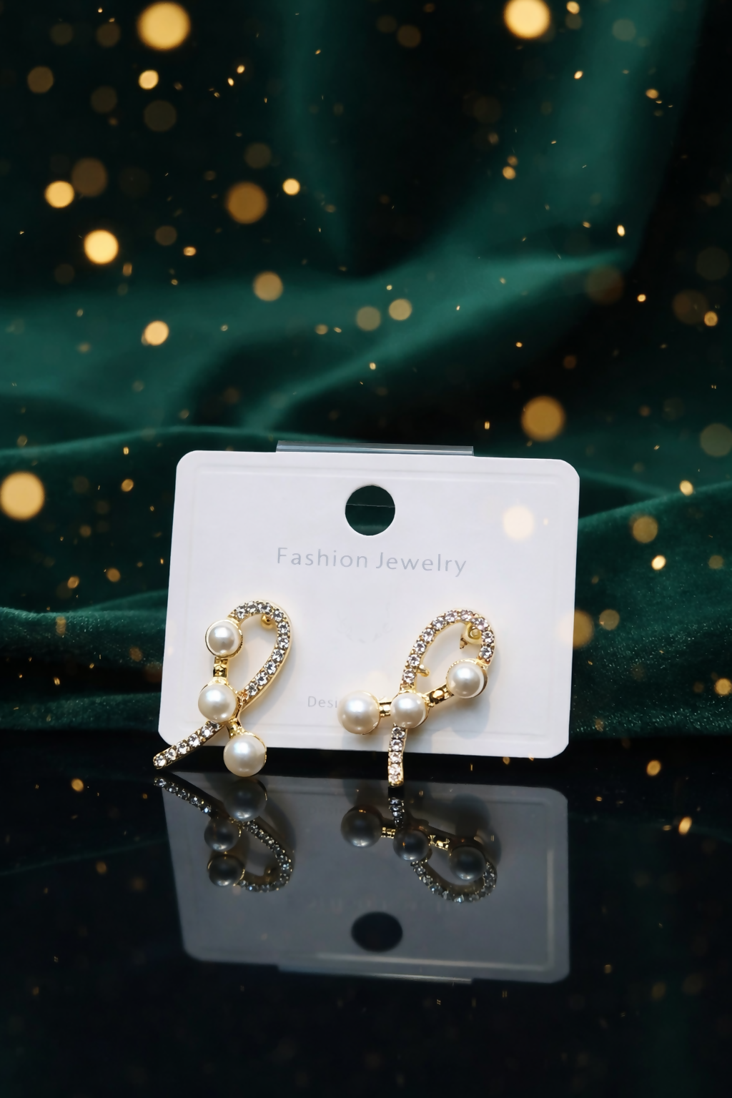Pearl Ribbon Earrings with gold plated finish and crystal detailing in Korean style