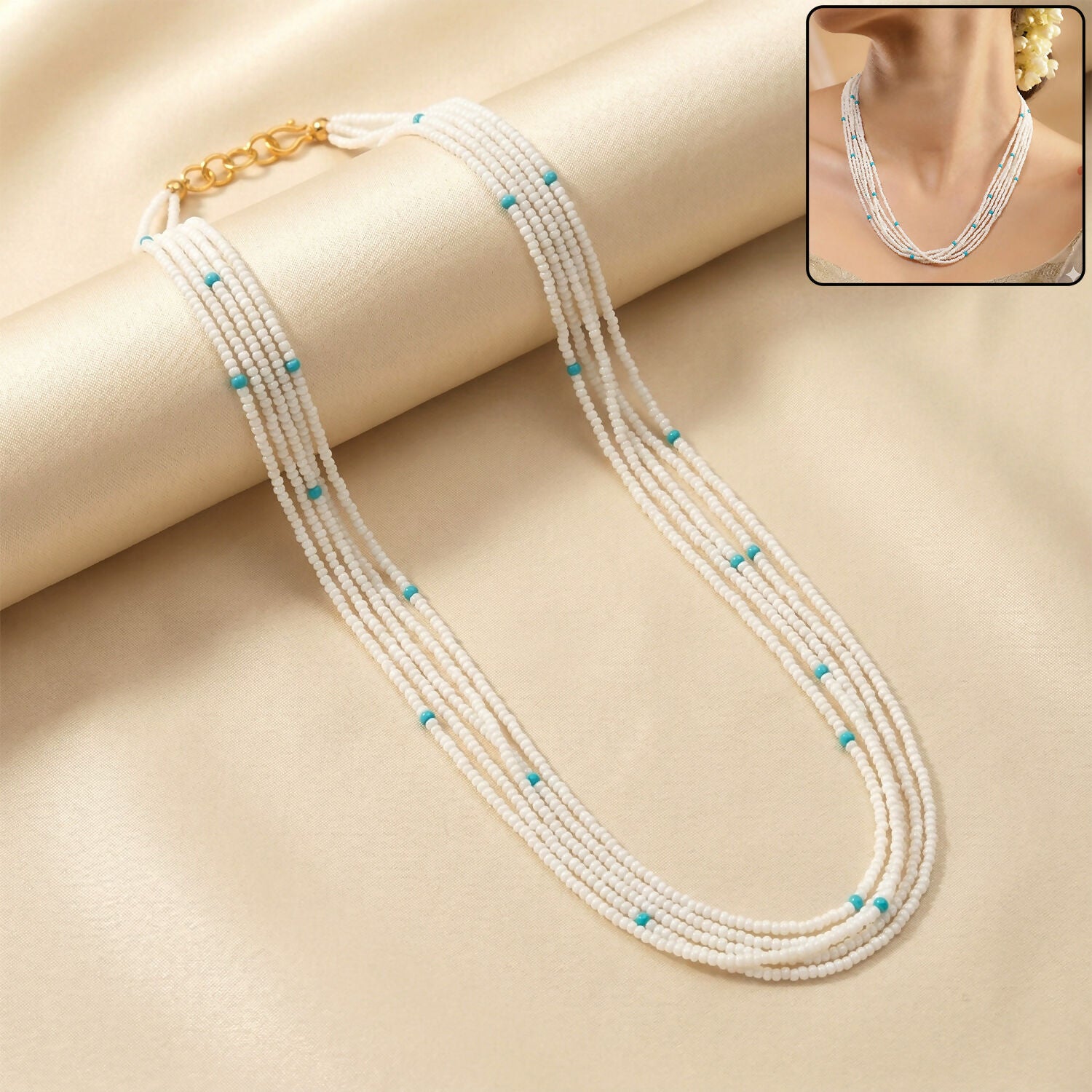 Multi-layer pearl mala necklace with blue accent beads for festive occasions