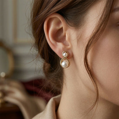 Korean infinity stud earrings with two white synthetic pearls