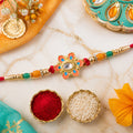 Orange and Teal Floral Kundan Pendant Rakhi with Pastel Beads