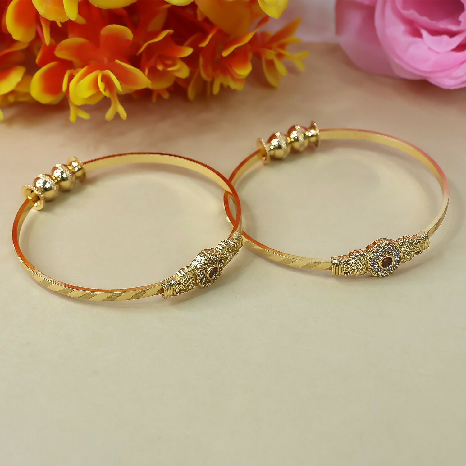 Elegant floral bangle with stone center and beaded accents