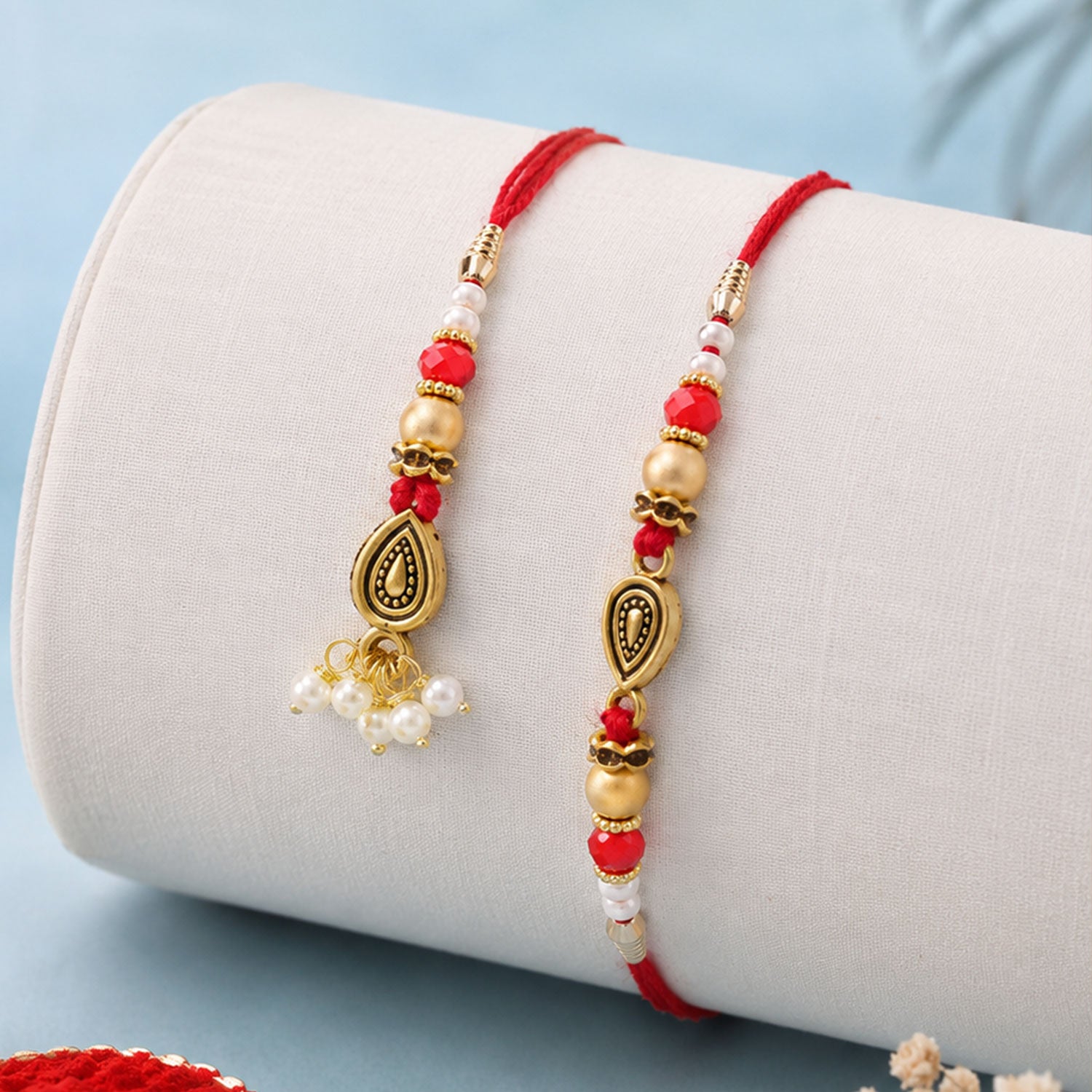 Graceful Teardrop Eye Bhai Bhabhi Rakhi with Drop Pendant and Pearl Tassel for Gift
