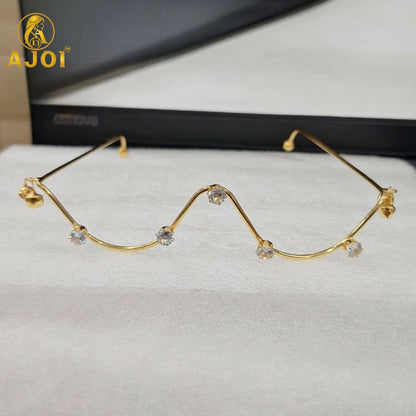 Close up of zigzag crystal detailing on gold plated goggles