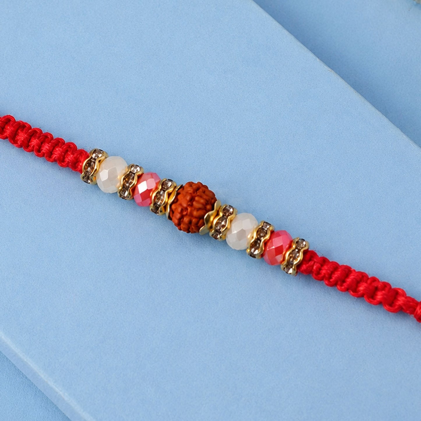Stone Studded Designer Rakhi with Traditional Beads and Beautiful Festive Finish