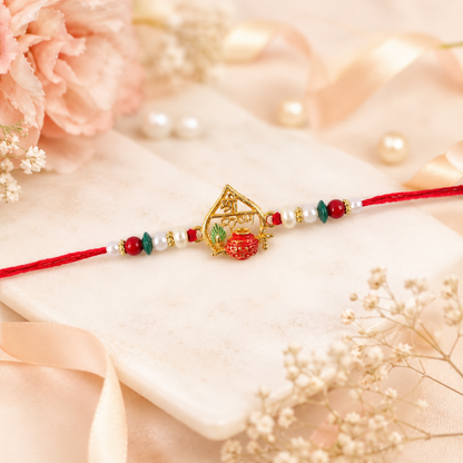 Golden Shri Krishna Dahi-Handi Frame Rakhi with Red Green Beads and Pearl Accents