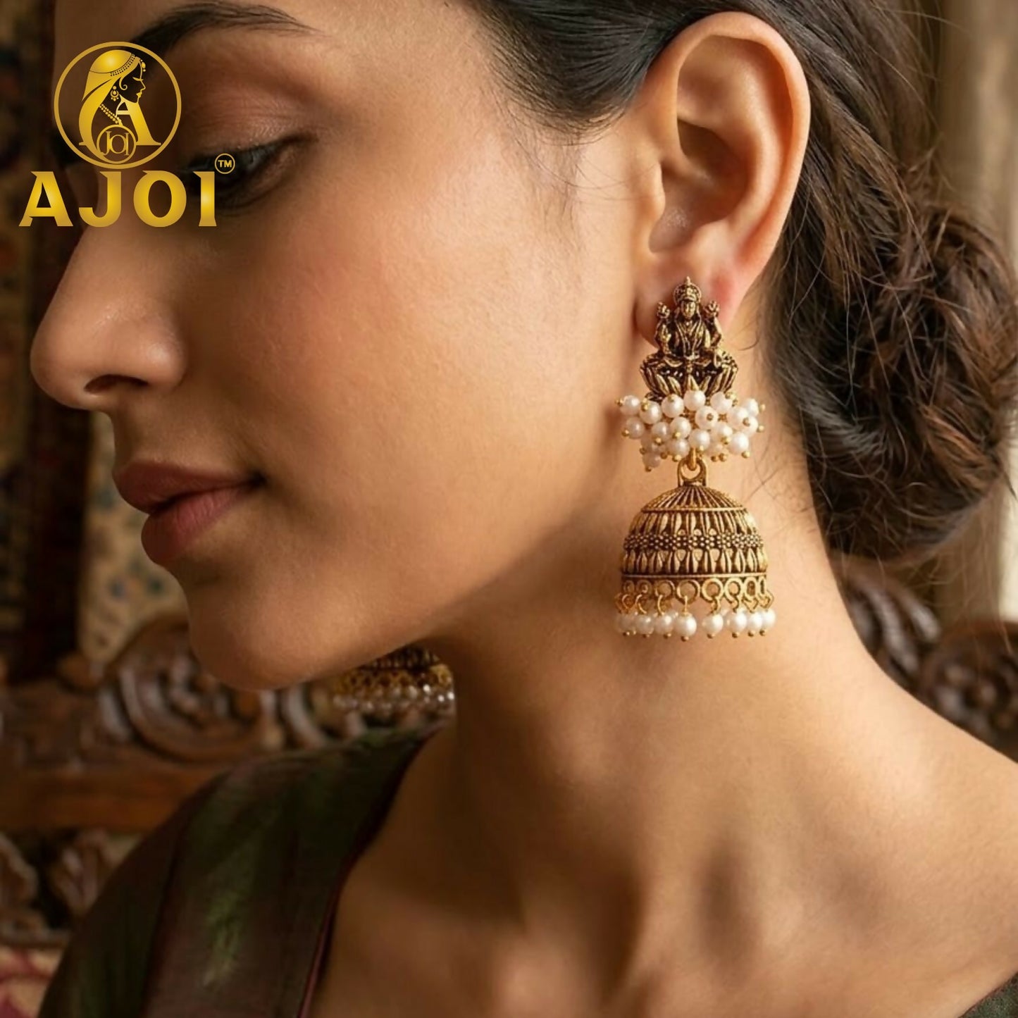 Side angle of antique gold pearl jhumka earrings