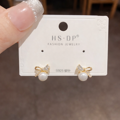 Pearl butterfly stud earrings front view