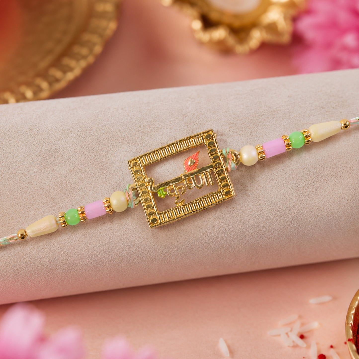 Krishna Script Pendant Rakhi with Red Flower Accent