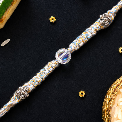 Pastel Braided Rakhi with Blue-White Thread and Crystal Bead Charm for Raksha Bandhan
