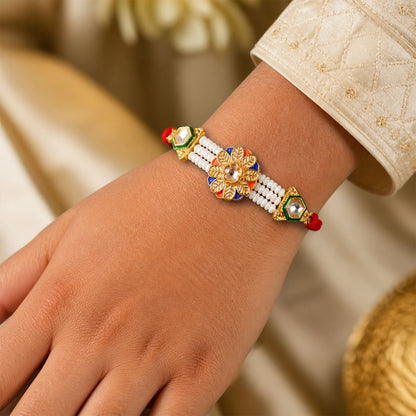 Pearl Flower Rakhi with Blue Yellow Details and Elegant Festive Brother Gift Styling