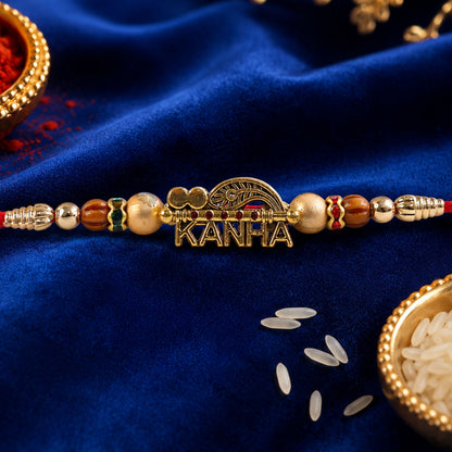 Kanha Krishna Devotional Rakhi with Peacock-Flute Style Golden Centre and Red Beads