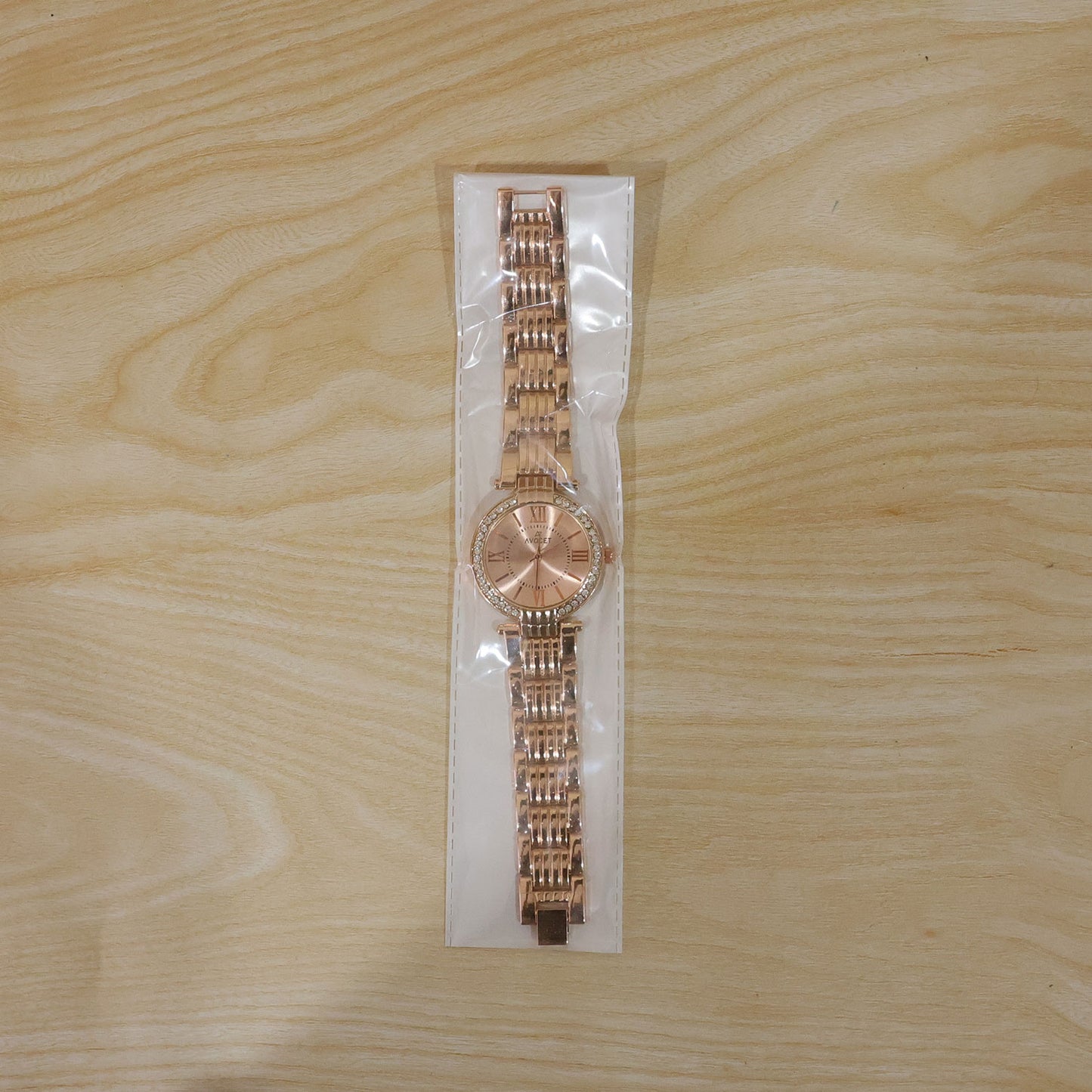 The women's rose gold watch styled with a formal outfit, perfect for office or events.