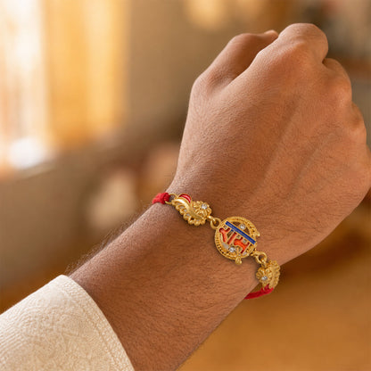 Gold-Toned Ram Rakhi with Orange-Blue Enamel, Crystal Accents & Red Thread