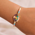 Meenakari Round Pendant Rakhi with Pastel Beads