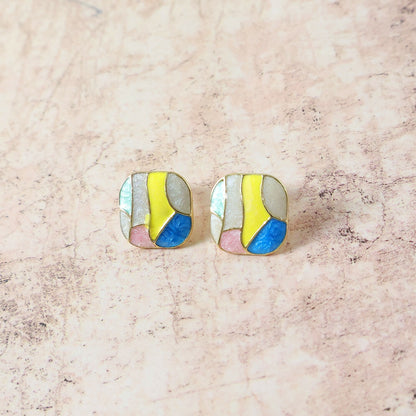 Pair of colorful Korean enamel stud earrings on white background