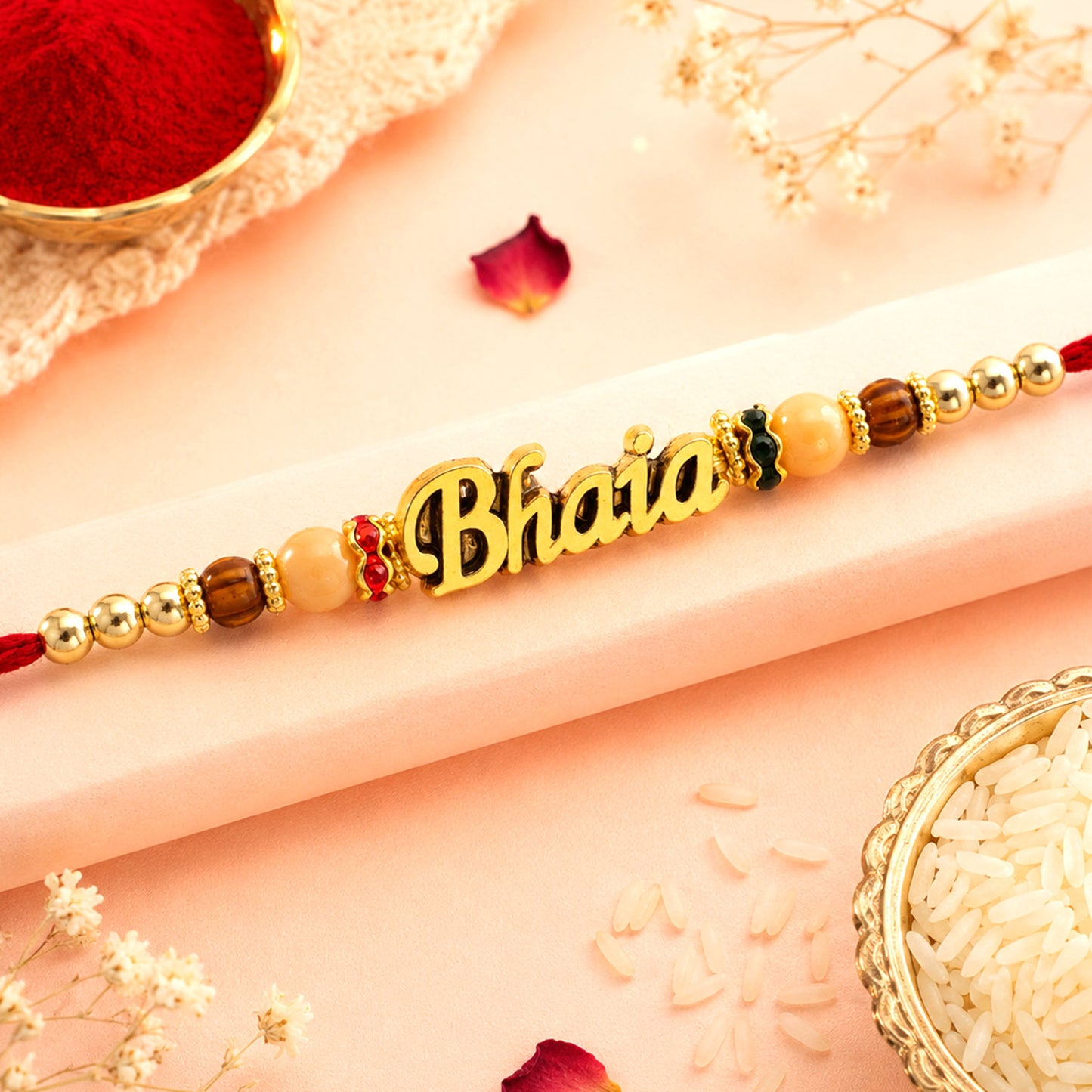 Bhaiya Name Golden Rakhi with Peach Brown Beads, Red Thread and Festive Shine