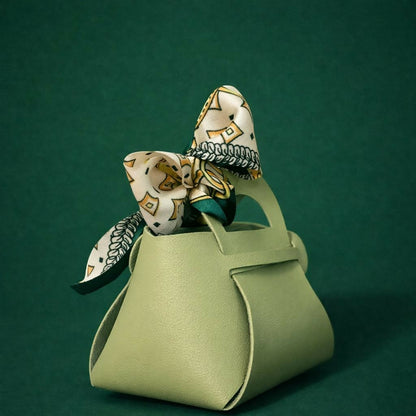 Side view of green handbag organizer with decorative bow