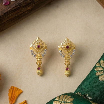 Fashionable gold plated earrings styled for festive ethnic wear