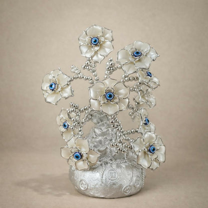 Elegant silver table décor with flower tree and evil eye design for home or office