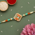 Pearl Bordered Meenakari Pendant Rakhi with Orange and Teal Enamel