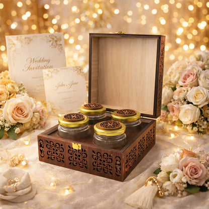 Side view of artisanal wooden gift chest with deep-relief floral carvings and gold clasp