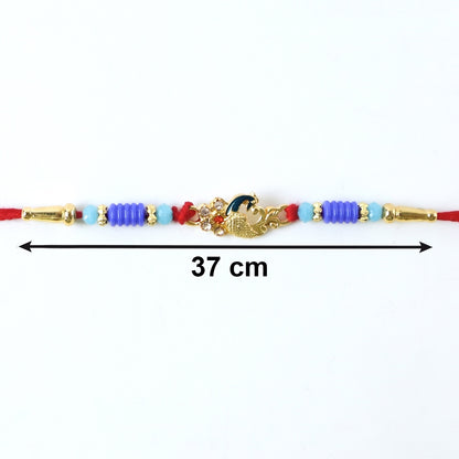 Hand holding Antique Mini Peacock Designer Rakhi showcasing softness