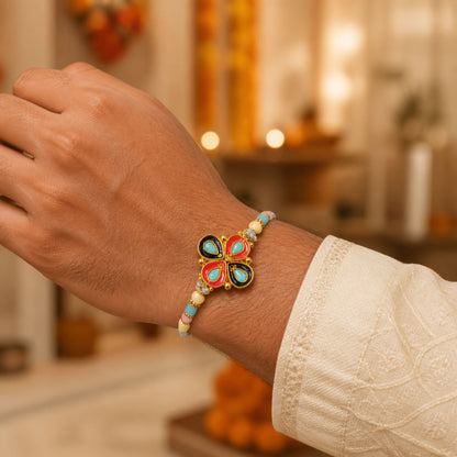 Four-Petal Floral Rakhi with Cream Thread, Multicolor Enamel and Floral Motif Design