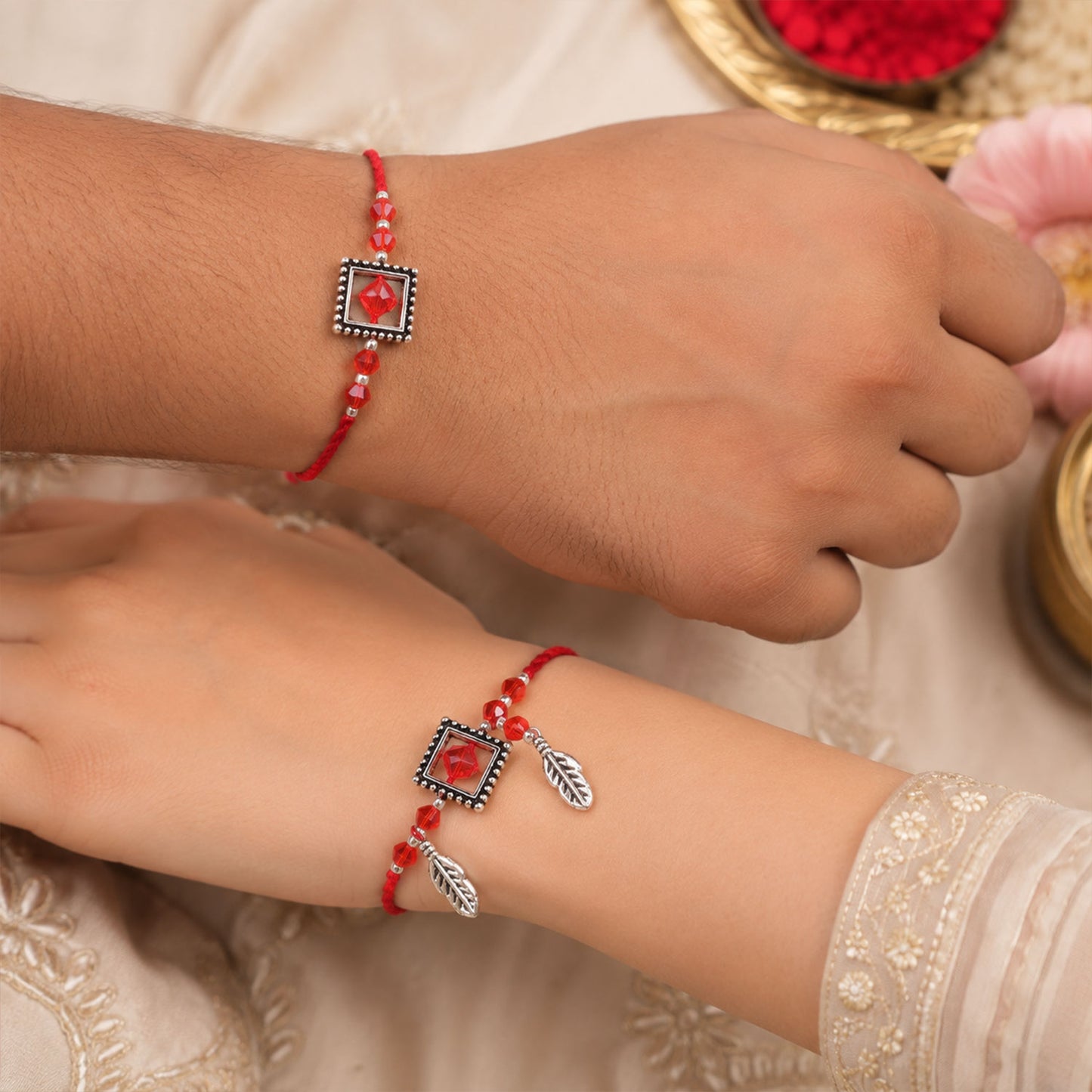 Red Gem Square Rakhi Set with Silver Bead Border and Leaf Charms for Couple Gift